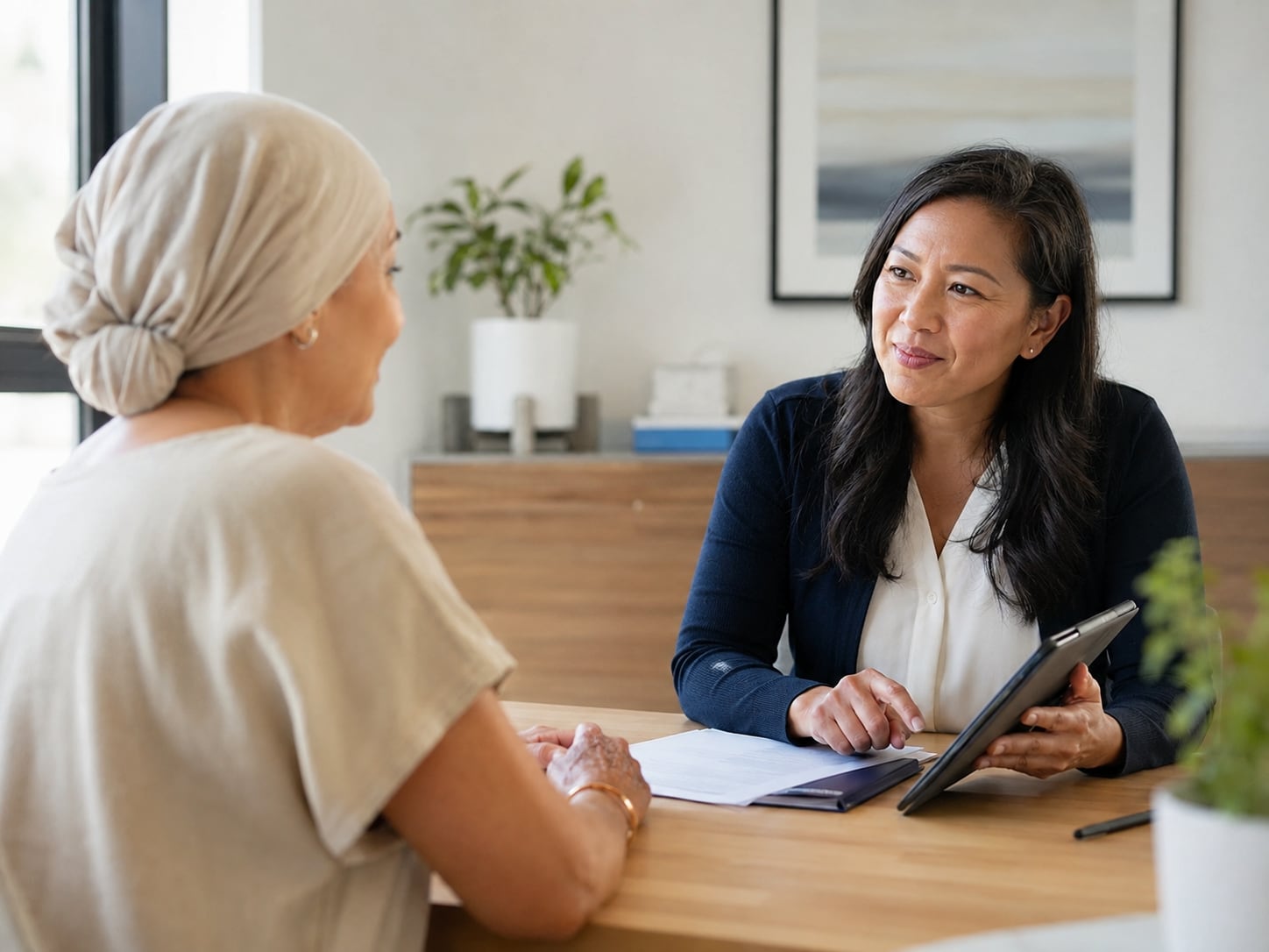 A clinician in a consultation room explaining test results and next steps