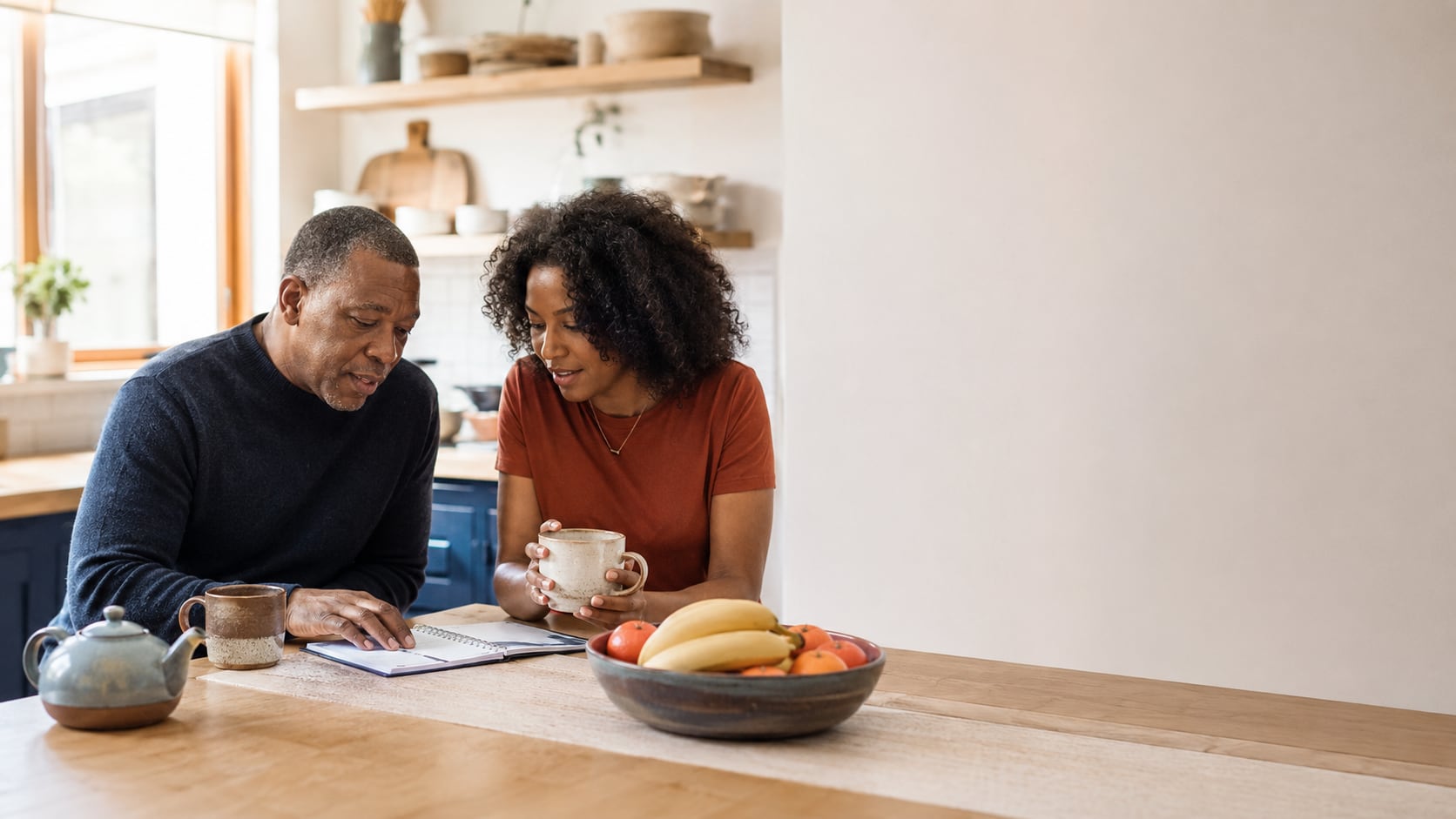 A care navigator reviewing a care roadmap with an older adult at a table